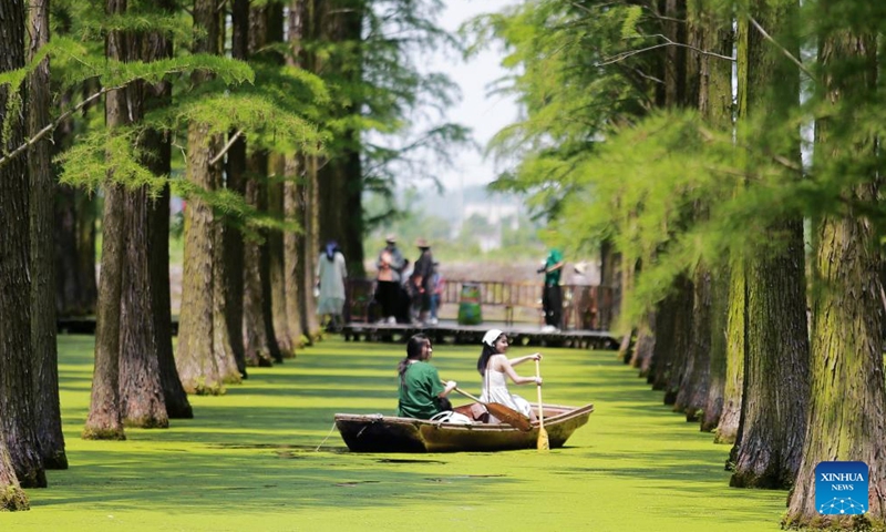 This photo taken on June 9, 2024 shows tourists rowing boats at Luyang Lake wetland park in Yangzhou, east China's Jiangsu Province. People enjoy the 3-day holiday of the Dragon Boat Festival, also called Duanwu Festival, which falls on June 10 this year, via various activities across the country. (Photo: Xinhua)