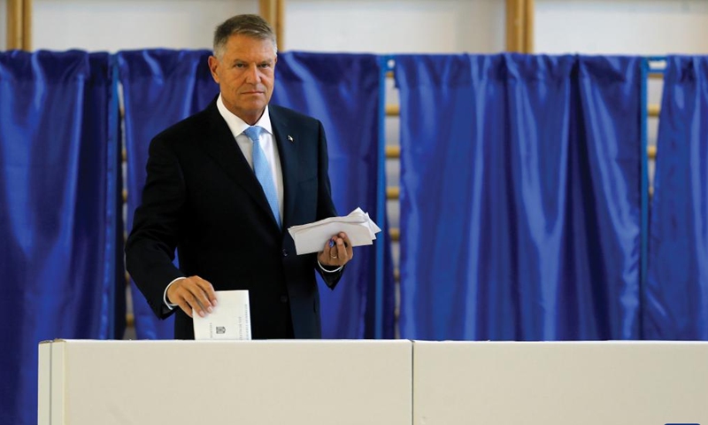 Romanian President Klaus Iohannis votes for the European Parliament elections and local elections at a polling station in Bucharest, Romania, June 9, 2024. (Photo: Xinhua)