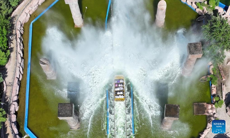 An aerial drone photo taken on June 9, 2024 shows people having fun at the Fantawild Adventure in Shenyang, northeast China's Liaoning Province. People enjoy the 3-day holiday of the Dragon Boat Festival, also called Duanwu Festival, which falls on June 10 this year, via various activities across the country. (Photo: Xinhua)