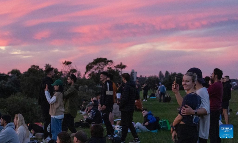 People enjoy sunset at Dudley Page Reserve in Sydney, Australia, June 9, 2024. (Photo: Xinhua)