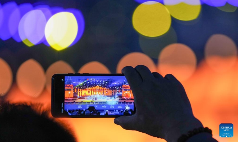 An audience shoots a video of the live-action performance Encounter Harbin staged at Sun Island scenic spot in Harbin, northeast China's Heilongjiang Province, June 10, 2024. (Photo: Xinhua)