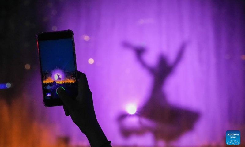 An audience shoots a video of the live-action performance Encounter Harbin staged at Sun Island scenic spot in Harbin, northeast China's Heilongjiang Province, June 10, 2024. (Photo: Xinhua)