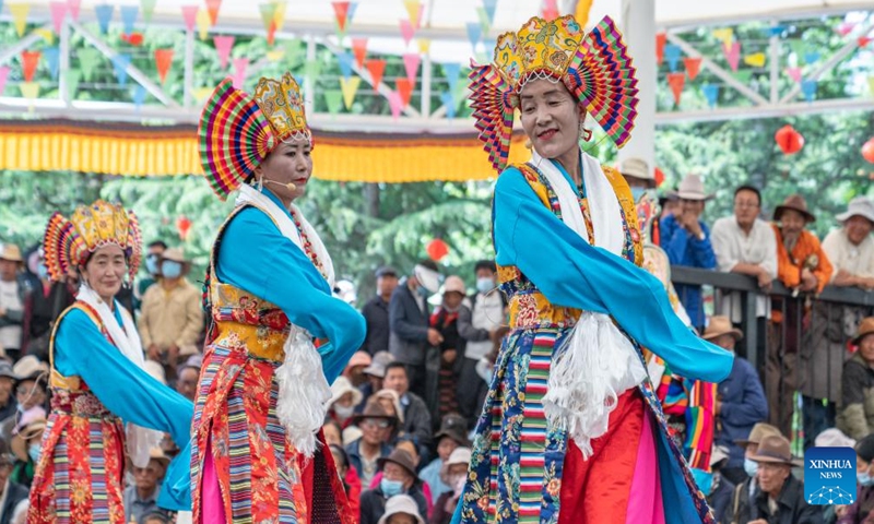 Folk artists stage a Tibetan opera performance near the Potala Palace in Lhasa, southwest China's Xizang Autonomous Region, June 11, 2024. A five-day Tibetan opera show kicked off here on June 9. (Photo: Xinhua)