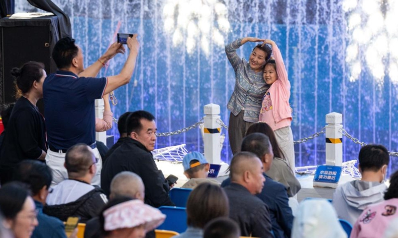 Audience pose for photos before the staging of live-action performance Encounter Harbin at Sun Island scenic spot in Harbin, northeast China's Heilongjiang Province, June 10, 2024. (Photo: Xinhua)