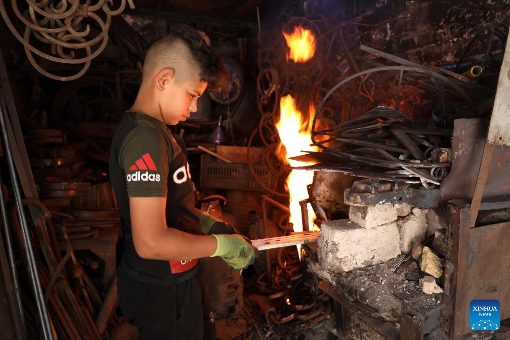 Sajjad, 14, works in a blacksmith shop in Baghdad, Iraq, on June 8, 2024.(Photo: Xinhua)