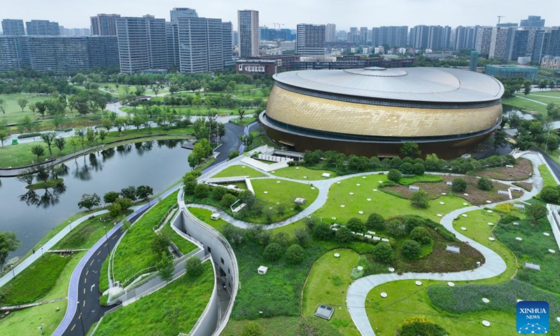 An aerial drone photo taken on June 12, 2024 shows the Gongshu Canal Sports Park Gymnasium in Hangzhou, east China's Zhejiang Province. With a history of more than 2,500 years, the Grand Canal, connecting Beijing and Hangzhou in east China's Zhejiang Province, served as a significant transportation artery in ancient China. The canal was listed as a UNESCO World Heritage Site in China in June 2014.(Photo: Xinhua)