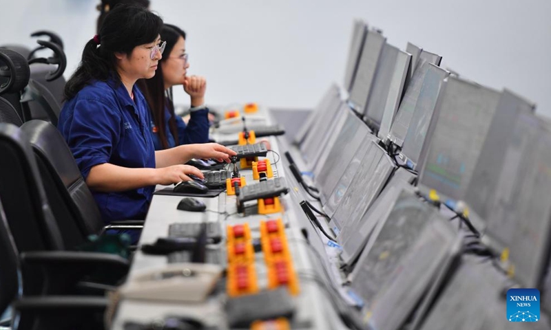 Workers operate heating furnace remotely at an intelligent center of an iron and steel factory in Xiangtan, central China's Hunan Province, June 13, 2024. With the application of technologies such as 5G and BeiDou Navigation Satellite System, the intelligent level of traditional industries in China's central region has been upgraded in recent years. (Photo: Xinhua)