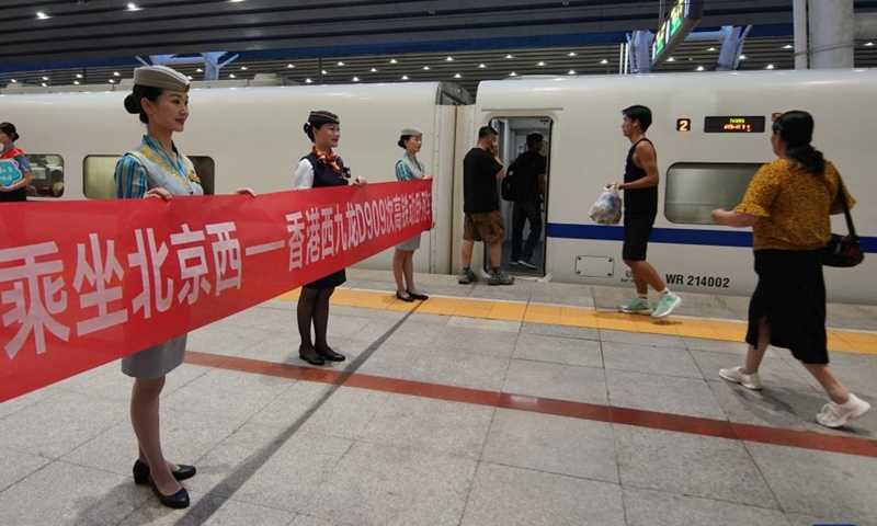 Passengers board the high-speed sleeper train D909 bound for Hong Kong's West Kowloon Station at Beijing West Railway Station in Beijing, capital of China, June 15, 2024. (Photo: Xinhua)