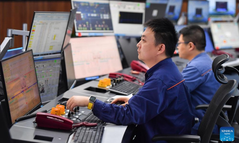 Workers operate equipment remotely at an intelligent center of an iron and steel factory in Xiangtan, central China's Hunan Province, June 13, 2024. With the application of technologies such as 5G and BeiDou Navigation Satellite System, the intelligent level of traditional industries in China's central region has been upgraded in recent years. (Photo: Xinhua)