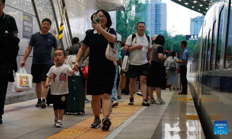 Passengers prepare to board the high-speed sleeper train D909 bound for Hong Kong's West Kowloon Station at Beijing West Railway Station in Beijing, capital of China, June 15, 2024. (Photo: Xinhua)