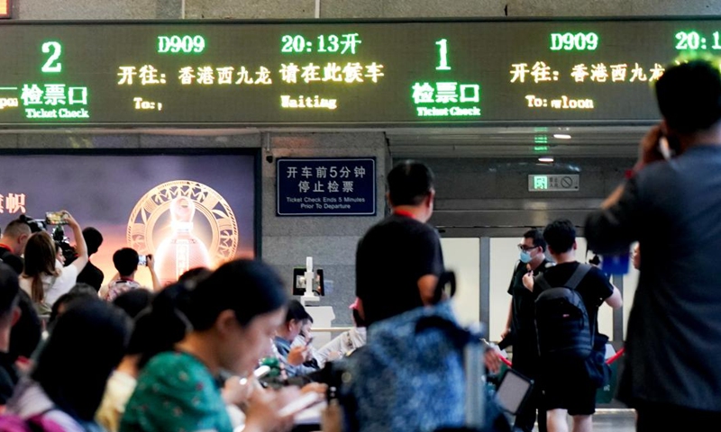 Passengers wait to board the high-speed sleeper train D909 bound for Hong Kong's West Kowloon Station at Beijing West Railway Station in Beijing, capital of China, June 15, 2024. (Photo: Xinhua)