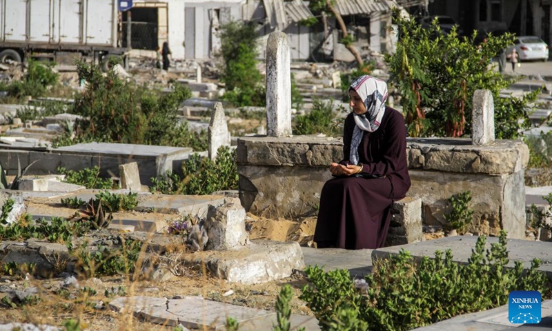 A Palestinian visits a cemetery in Jabalia refugee camp in the northern Gaza Strip on the first day of Eid al-Adha, on June 16, 2024.  (Photo: Xinhua)