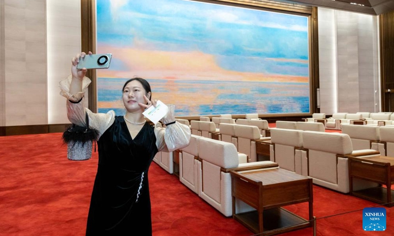 A citizen takes selfies at the Grand Halls in Shanghai, east China, June 16, 2024. The first public open day of the Grand Halls was launched in Shanghai on Sunday, attracting many visitors. Consisting of three old buildings with an area of 99,000 square meters, the Grand Halls previously was the Yangtze River wharf with a history of more than 100 years. (Photo: Xinhua)