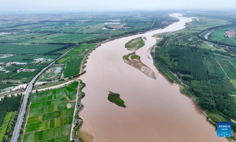 An aerial drone photo taken on June 13, 2024 shows a section of the Yellow River in northwest China's Ningxia Hui Autonomous Region. The Yellow River, China's second-largest river after the Yangtze, is dubbed the mother river. In recent years, continued efforts have been made to protect its ecology, as vitality has returned to the Yellow River basin in Ningxia. (Photo: Xinhua)