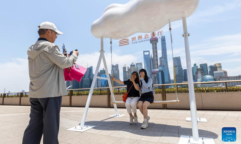 People take photos outside the Grand Halls in Shanghai, east China, June 16, 2024. The first public open day of the Grand Halls was launched in Shanghai on Sunday, attracting many visitors. Consisting of three old buildings with an area of 99,000 square meters, the Grand Halls previously was the Yangtze River wharf with a history of more than 100 years. (Photo: Xinhua)