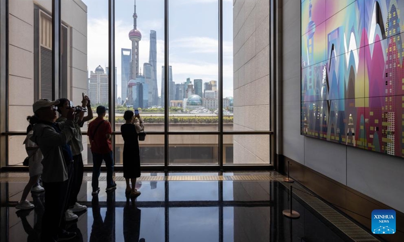 People take photos at the Grand Halls in Shanghai, east China, June 16, 2024. The first public open day of the Grand Halls was launched in Shanghai on Sunday, attracting many visitors. Consisting of three old buildings with an area of 99,000 square meters, the Grand Halls previously was the Yangtze River wharf with a history of more than 100 years.  (Photo: Xinhua)