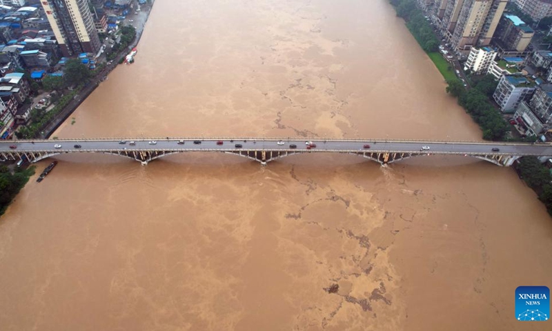 An aerial drone photo taken on June 18, 2024 shows surging water flow in the section of Rongjiang River in Rong'an County, south China's Guangxi Zhuang Autonomous Region. As of 11 a.m. Tuesday, torrential rainfall has elevated the water level in this section of Rongjiang River to 114.79 meters, or 0.19 meters above the alert line.(Photo: Xinhua) 
