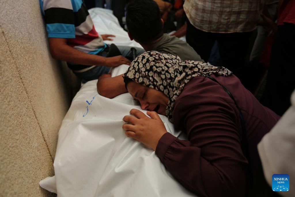 A woman grieves during the mourning of victims at a hospital in the southern Gaza Strip city of Khan Younis, on June 18, 2024.(Photo: Xinhua) 