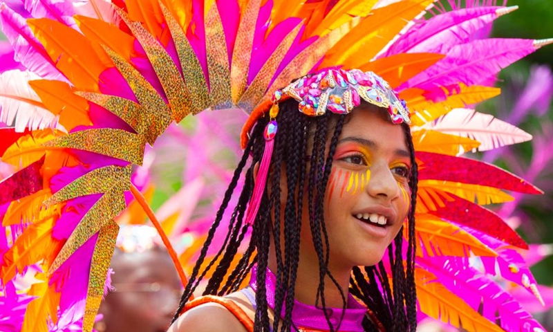 A dressed-up girl attends the Junior Carnival Parade of the 2024 Toronto Caribbean Carnival in Toronto, Canada, on July 20, 2024. The annual event kicked off here on Saturday with thousands of young participants in vibrant costumes celebrating Caribbean culture with music and dance. (Photo by Zou Zheng/Xinhua)