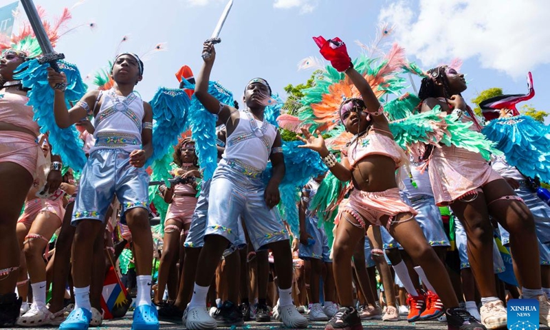 Dressed-up participants are pictured during the Junior Carnival Parade of the 2024 Toronto Caribbean Carnival in Toronto, Canada, on July 20, 2024. The annual event kicked off here on Saturday with thousands of young participants in vibrant costumes celebrating Caribbean culture with music and dance. (Photo by Zou Zheng/Xinhua)