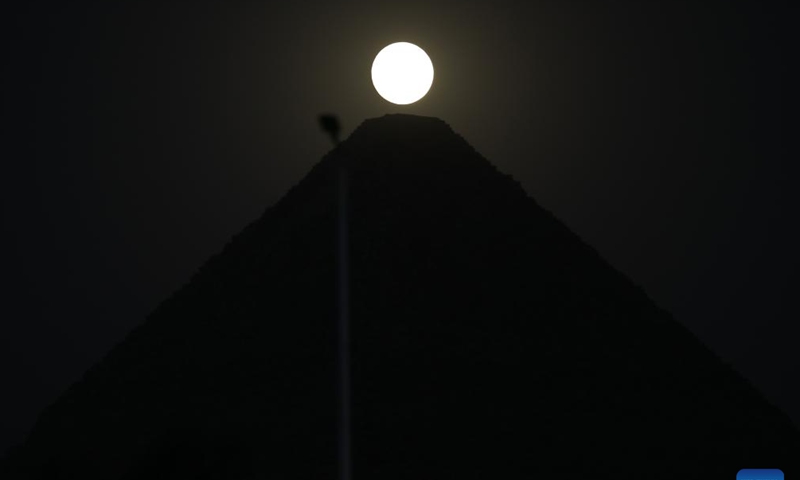 A full moon is seen in the sky over the Khufu Pyramid in Giza, Egypt, on July 20, 2024. (Xinhua/Ahmed Gomaa)