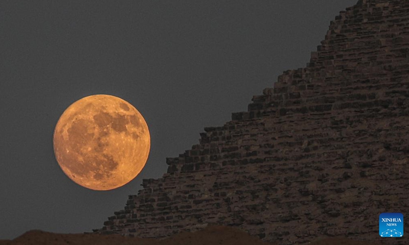 A full moon rises by the Khufu Pyramid in Giza, Egypt, on July 20, 2024. (Xinhua/Ahmed Gomaa)