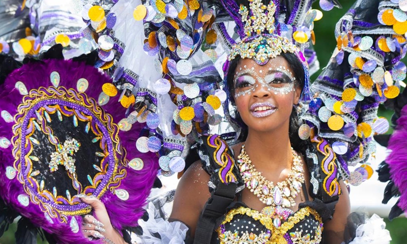 A dressed-up girl dances during the Junior Carnival Parade of the 2024 Toronto Caribbean Carnival in Toronto, Canada, on July 20, 2024. The annual event kicked off here on Saturday with thousands of young participants in vibrant costumes celebrating Caribbean culture with music and dance. (Photo by Zou Zheng/Xinhua)