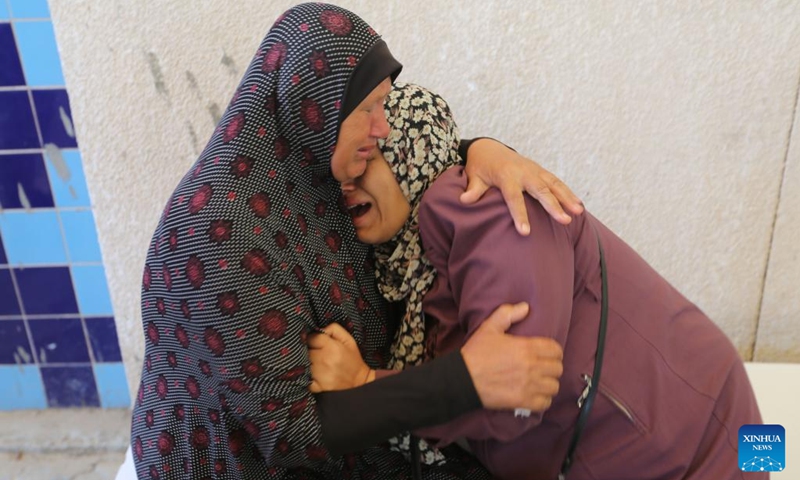 People grieve during the mourning of victims at a hospital in the southern Gaza Strip city of Khan Younis, on June 18, 2024.(Photo: Xinhua) 
