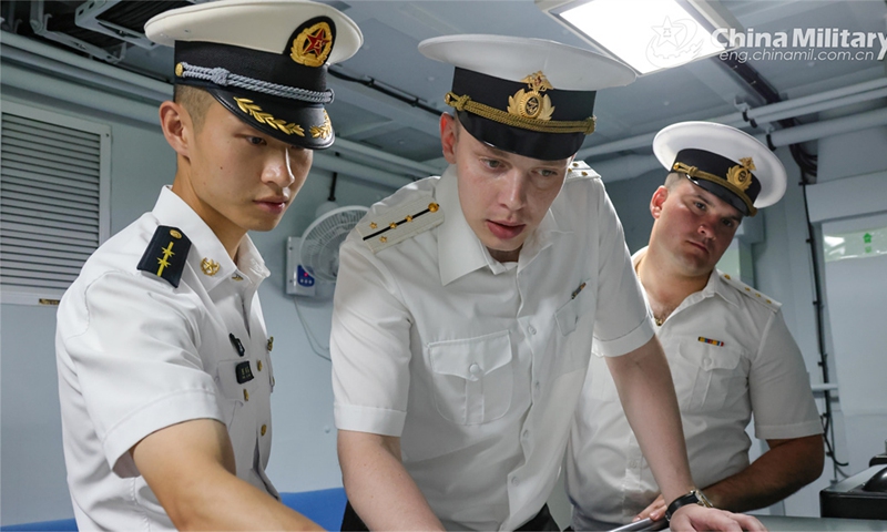 Chinese and Russian naval officers communicate with each other during the China-Russia joint naval exercise coded Exercise Joint Sea-2024 on July 13, 2024. (eng.chinamil.com.cn/Photo by Luan Cheng)