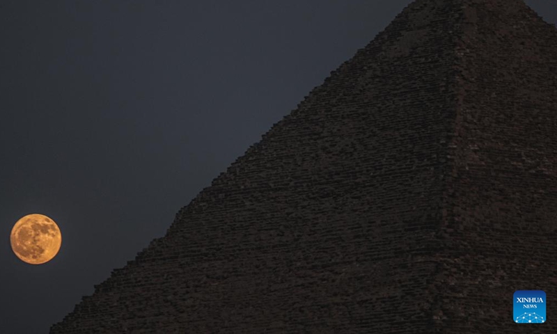 A full moon rises by the Khufu Pyramid in Giza, Egypt, on July 20, 2024. (Xinhua/Ahmed Gomaa)