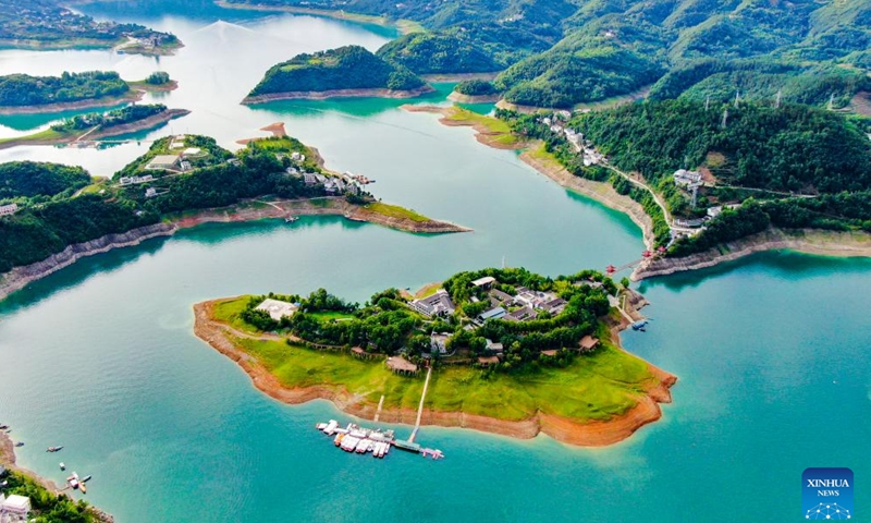 An aerial drone photo taken on June 21, 2024 shows the scenery of Yinghu Lake scenic spot in Ankang, northwest China's Shaanxi Province. Water quality of Yinghu Lake has improved significantly in recent years, and the forest coverage rate along its shore has reached 76 percent. (Xinhua/Cai Xiangxin)