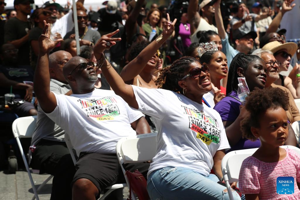 The audience watch a performance in celebration of Juneteenth in New York, the United States, on June 19, 2024. African Americans in New York joined others on Wednesday in commemorating the ending of slavery in the United States, as a heat wave is scorching the Northeast and Midwest of the country. (Photo: Xinhua)