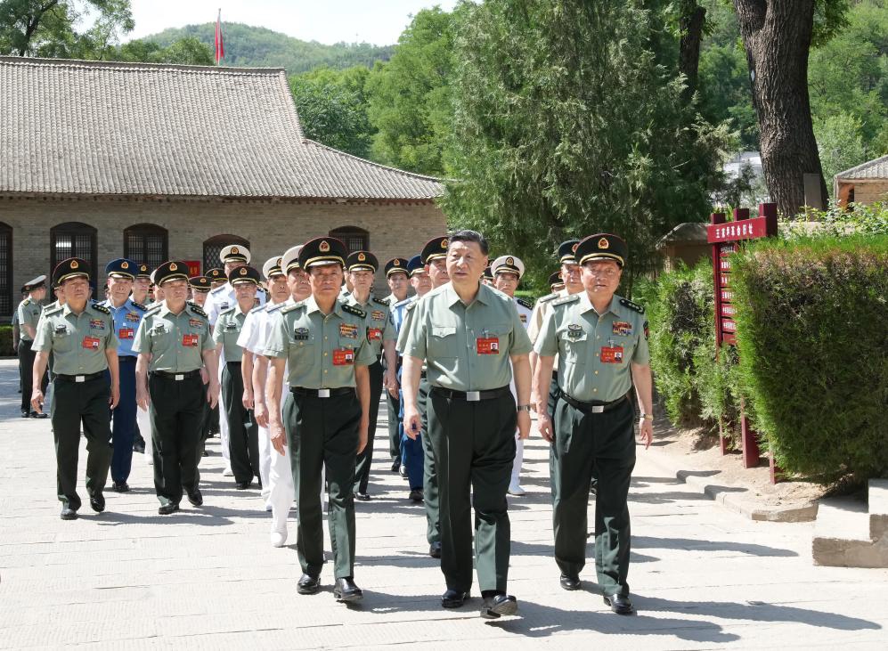 Chinese President Xi Jinping, also general secretary of the Communist Party of China Central Committee and chairman of the Central Military Commission (CMC), leads CMC members and heads of various departments and units to visit the revolutionary relics at Wangjiaping in Yan'an, northwest China's Shaanxi Province, June 17, 2024. The CMC Political Work Conference was held from Monday to Wednesday in Yan'an, an old revolutionary base in northwest China's Shaanxi Province.(Photo: Xinhua)