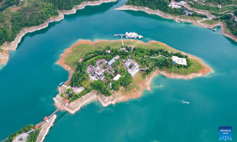 An aerial drone photo taken on June 21, 2024 shows the scenery of Yinghu Lake scenic spot in Ankang, northwest China's Shaanxi Province. Water quality of Yinghu Lake has improved significantly in recent years, and the forest coverage rate along its shore has reached 76 percent. (Xinhua/Cai Xiangxin)