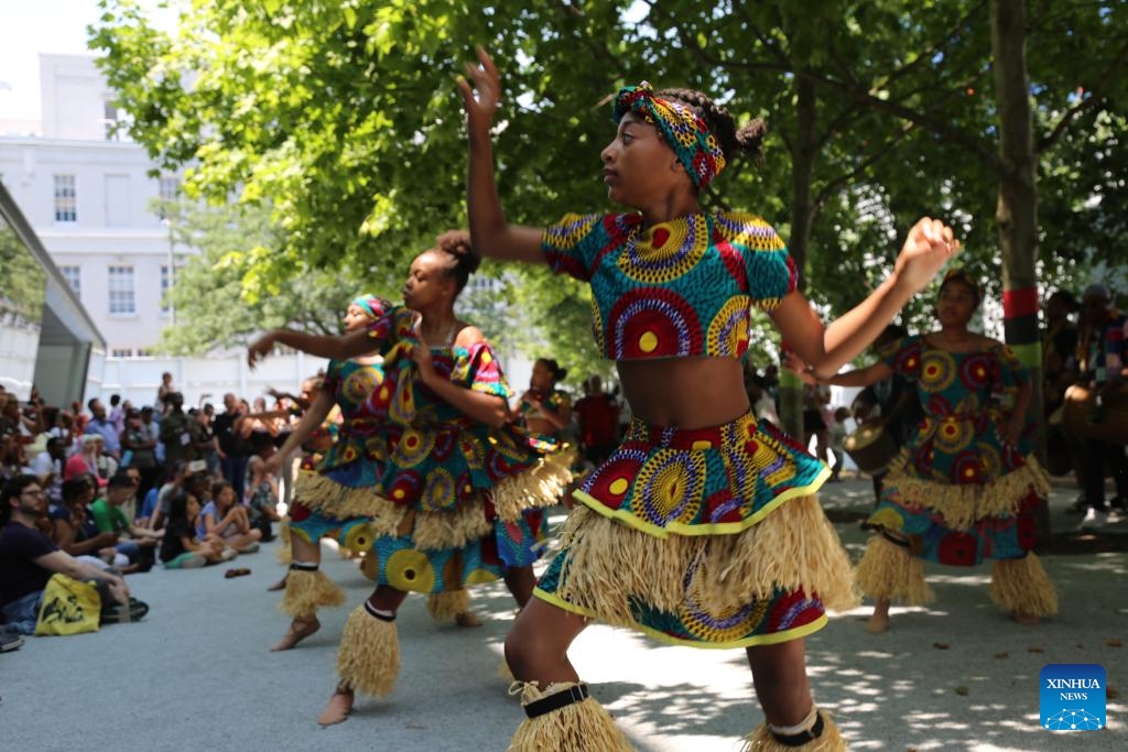 Children perform at Museum of the Moving Image in New York, the United States, on June 19, 2024. African Americans in New York joined others on Wednesday in commemorating the ending of slavery in the United States, as a heat wave is scorching the Northeast and Midwest of the country. (Photo: Xinhua)