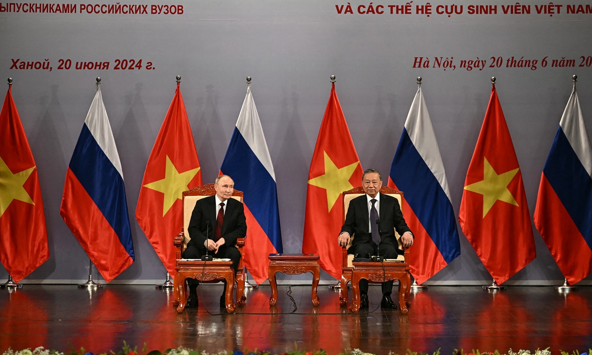 Russian President Vladimir Putin (left) and Vietnam's President To Lam take part in an event attended by the Vietnam Friendship Association and generations of Vietnamese alumni that studied in Russia at the Hanoi Opera House in Hanoi on June 20, 2024. Photo: AFP