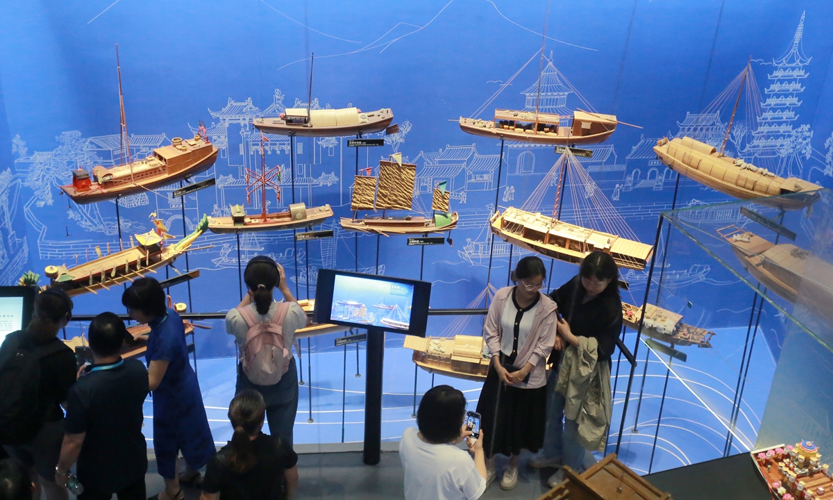 Visitors explore an exhibition at the China Grand Canal Museum in Yangzhou, East China's Jiangsu Province on June 20, 2024. The museum, opened in 2021, is China's first comprehensive modern museum integrating preservation, scientific research and exhibition of cultural relics, and social education on the Grand Canal, a vast waterway connecting the northern and southern parts of China. Photo: VCG