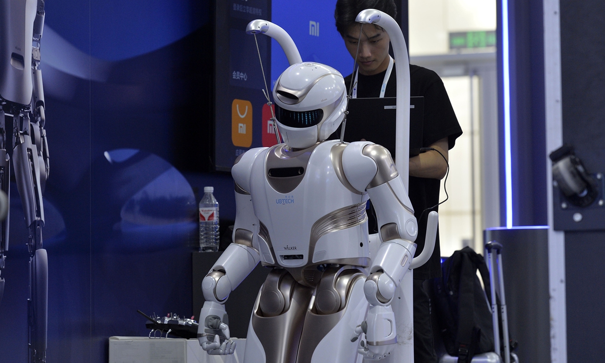 Staff test a robot at the 2024 World Intelligence Expo in North China's Tianjin on June 18. Photo: VCG 