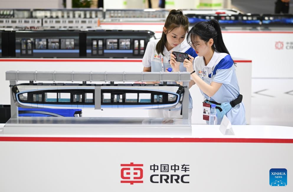 People visit the booth of China Railway Rolling Stock Corporation (CRRC) at the World Intelligence Expo 2024 in north China's Tianjin, June 20, 2024. The World Intelligence Expo 2024 opened on Thursday in Tianjin. With the theme of Intelligence: Extensive Development Space, Sustainable Growth Driver, the expo is co-hosted by the Tianjin municipal government and Chongqing municipal government.(Photo: Xinhua)