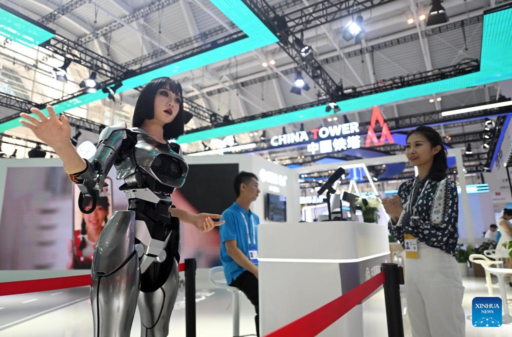 A visitor interacts with a bio-robot at the World Intelligence Expo 2024 in north China's Tianjin, June 20, 2024. The World Intelligence Expo 2024 opened on Thursday in Tianjin. With the theme of Intelligence: Extensive Development Space, Sustainable Growth Driver, the expo is co-hosted by the Tianjin municipal government and Chongqing municipal government.(Photo: Xinhua)