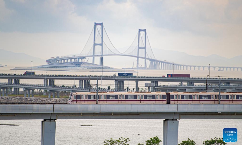 This photo taken on June 19, 2024 shows the Shenzhong Bridge and the west artificial island of the Shenzhen-Zhongshan Link (back) in south China's Guangdong Province.