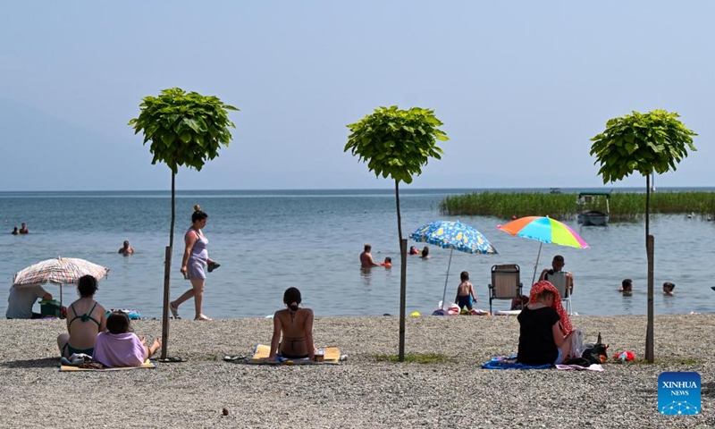 People enjoy themselves at Ohrid Lake in Struga, North Macedonia, on June 22, 2024. (Photo: Xinhua)