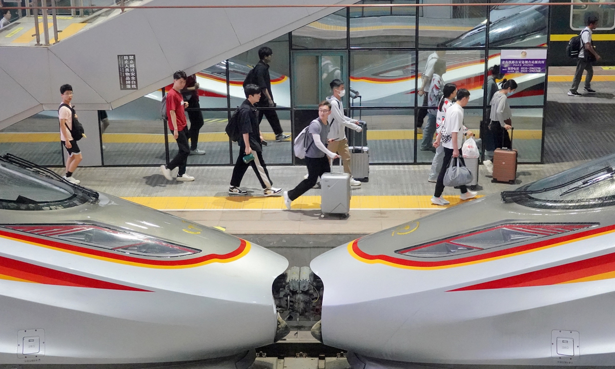 Passengers walk on a platform at a train station in Yantai, East China's Shandong Province on July 1, 2024. China is expected to see 860 million railway trips during the 62-day-long summer travel rush that kicks off on the same day, according to the country's railway operator.Photo: cnsphoto