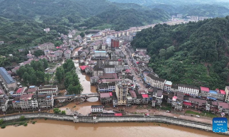 An aerial drone photo taken on June 23, 2024 shows Wuqiangxi Township of Yuanling County in central China's Hunan Province. Heavy rainfall hit Wuqiangxi Township on Saturday, triggering flood that impacted local residential area. Local authorities have carried out emergency response to minimize the impact of the extreme weather conditions. (Photo: Xinhua)