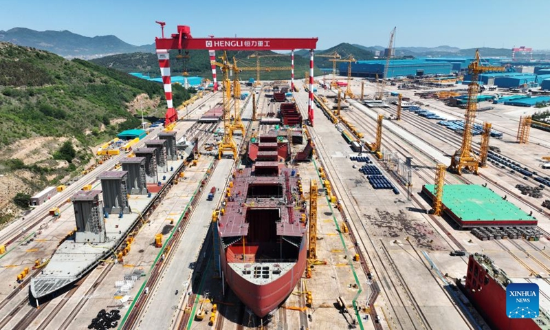 An aerial drone photo taken on June 16, 2024 shows a shipyard of Hengli Heavy Industry in Dalian, northeast China's Liaoning Province. The 2024 Summer Davos meeting will be held from June 25 to 27 in northeast China's coastal city of Dalian, according to the city's coordination office for Summer Davos.

Also known as the 15th World Economic Forum Annual Meeting of the New Champions, this year's forum will feature the theme Next Frontiers for Growth. (Photo: Xinhua)
