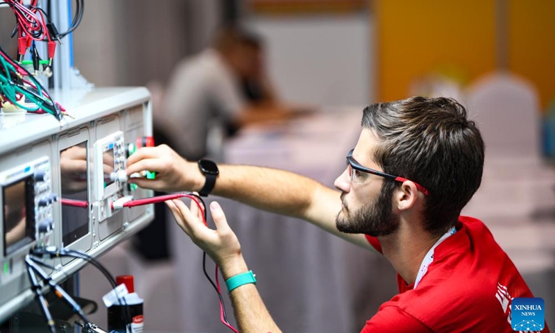 A contestant is pictured during a contest of the second Belt and Road International Skills Competition in southwest China's Chongqing Municipality on June 24, 2024. The second Belt and Road International Skills Competition kicked off at Chongqing International Expo Center here on Monday, attracting participants from 61 countries and regions.(Photo: Xinhua)