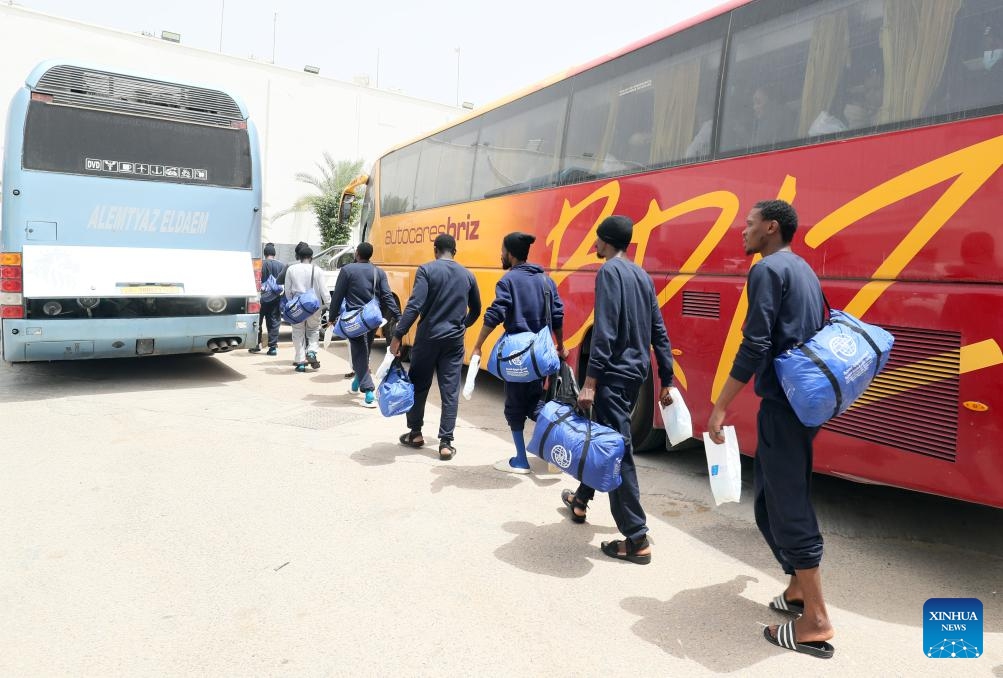 Migrants line up to get on a bus outside the Deportation Office of the Libyan Illegal Immigration Control Department in Tripoli, Libya, on June 25, 2024. A total of 174 migrants were deported from Libya to Nigeria on Tuesday with the assistance of the International Organization for Migration (IOM), according to a Libyan official.(Photo: Xinhua)