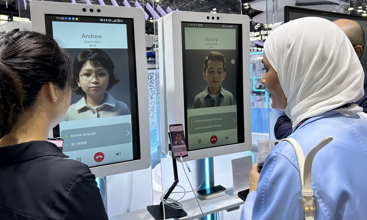 A visitor looks at her AI digital avatar at MWC Shanghai, on June 26, 2024. Photo: Qi Xijia/GT