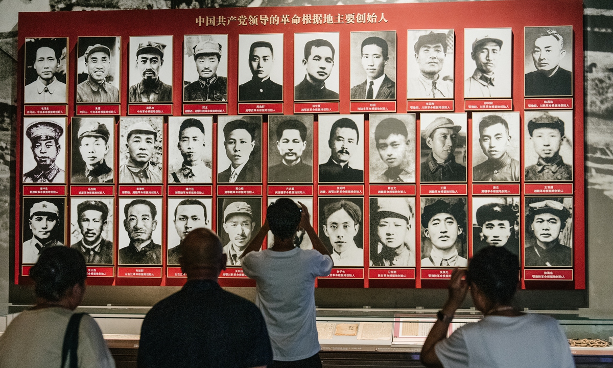 Visitors look at a display board that tells the story of the main founders of the revolutionary bases led by the Party at the Museum of the CPC in Beijing on June 18, 2024. Photo: Li Hao/GT