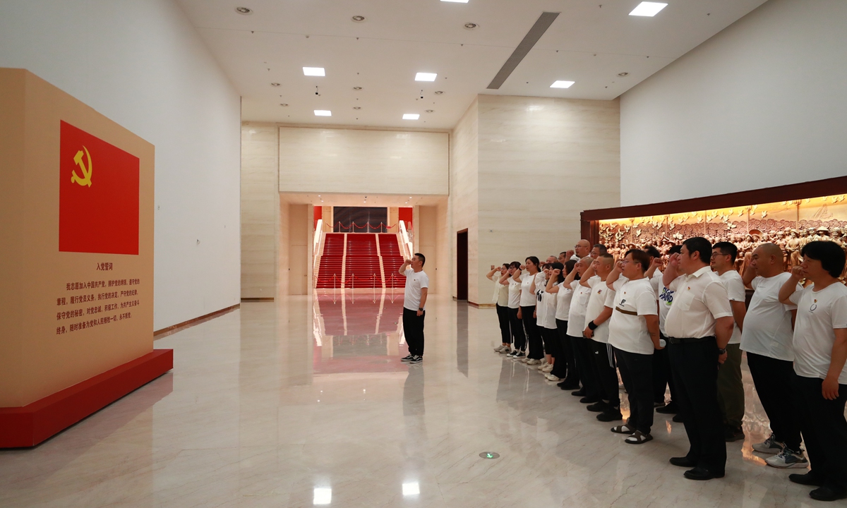 Members of the Communist Party of China take the Party admission oath at the Museum of the CPC in Beijing on June 14, 2024. Photo: VCG